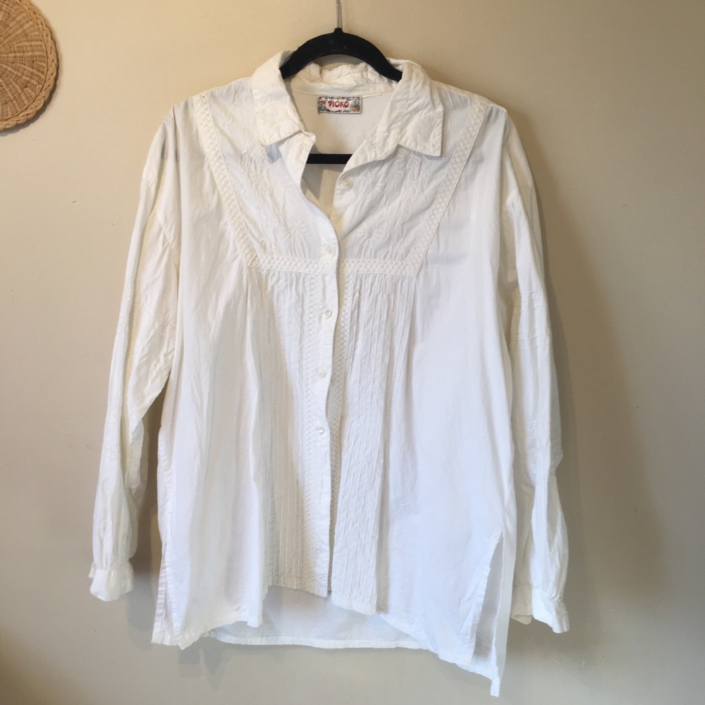 Pioko size large cream coloured unique shirt.